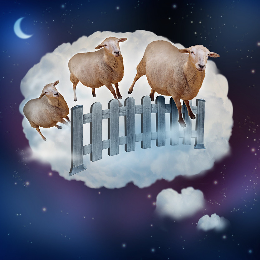 Counting sheep concept as a symbol of insomnia and lack of sleep due to challenges in falling asleep as a group of farm animals jumping over a fence in a dream bubble as an icon of bedtime for sleepy children and tired adults.